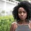 Portrait of a beautiful young woman in a city